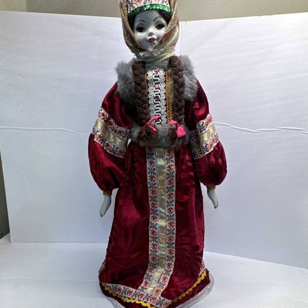 This is a handcrafted porcelain doll, likely from the Snow Maiden Collection